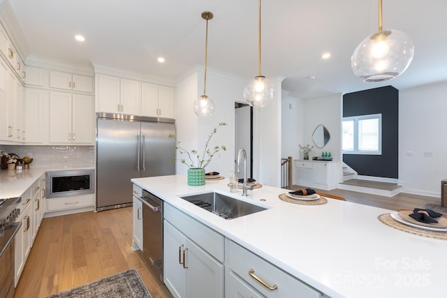 4203 Walker Rd, Charlotte, NC 28211 - kitchen with built in appliances, light wood finished floors, light countertops, hanging light fixtures, and recessed lighting