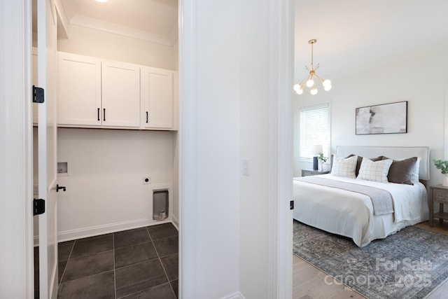 4203 Walker Rd, Charlotte, NC 28211 - bedroom with a chandelier, ornamental molding, and dark tile patterned floors