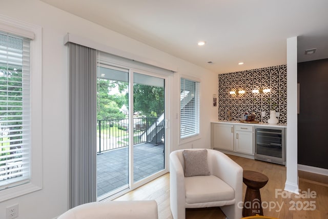 4203 Walker Rd, Charlotte, NC 28211 - indoor bar with beverage cooler, light wood finished floors, a chandelier, and recessed lighting