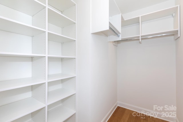 4203 Walker Rd, Charlotte, NC 28211 - walk in closet featuring wood finished floors
