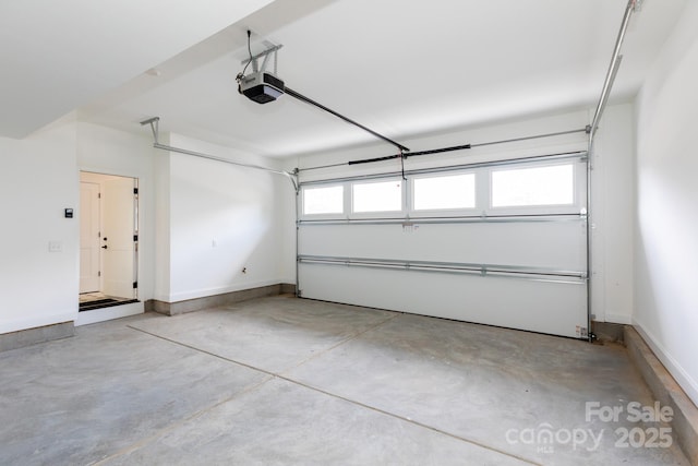 4203 Walker Rd, Charlotte, NC 28211 - garage featuring a garage door opener and baseboards