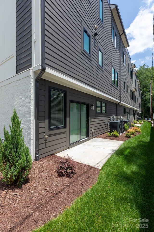 4203 Walker Rd, Charlotte, NC 28211 - back of house featuring a patio and a lawn