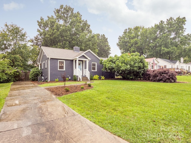 2421 Morton St, Charlotte, NC 28208 - view of front of house featuring driveway, a chimney, and central air condition unit
