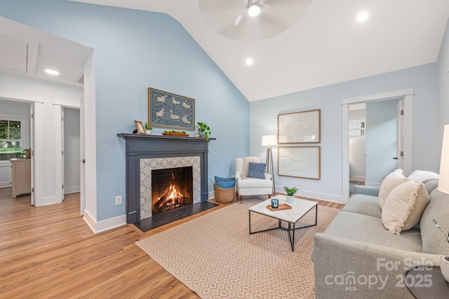 2421 Morton St, Charlotte, NC 28208 - living area with wood finished floors, vaulted ceiling, a fireplace, ceiling fan, and recessed lighting
