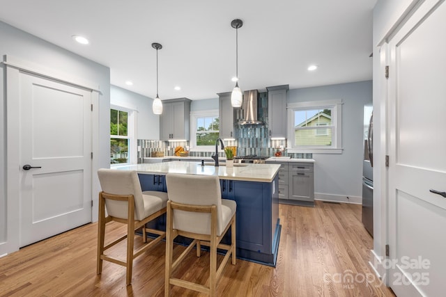 2421 Morton St, Charlotte, NC 28208 - kitchen featuring gray cabinets, range hood, a sink, light countertops, and recessed lighting