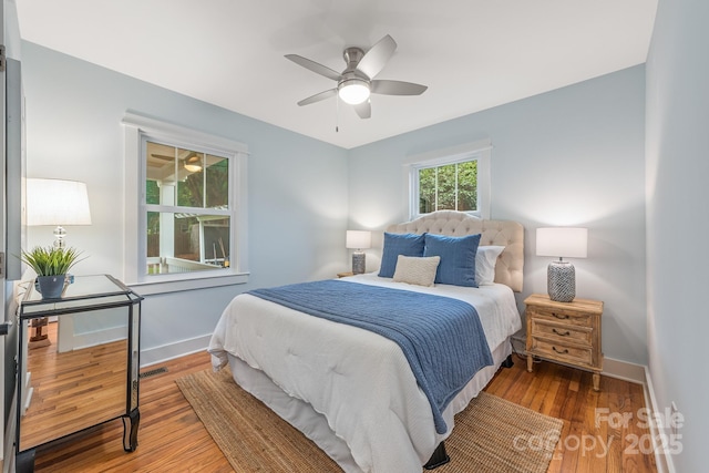 2421 Morton St, Charlotte, NC 28208 - bedroom with wood finished floors, baseboards, and ceiling fan