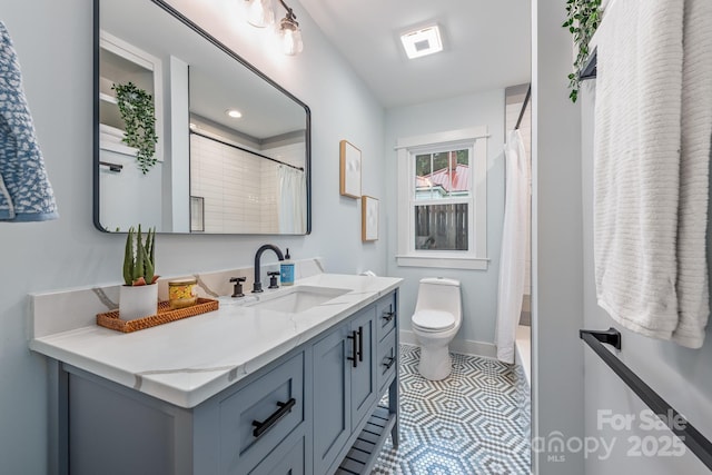 2421 Morton St, Charlotte, NC 28208 - full bathroom with vanity, toilet, curtained shower, and baseboards