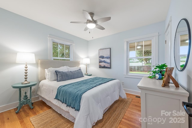 2421 Morton St, Charlotte, NC 28208 - bedroom featuring light wood-type flooring, baseboards, and a ceiling fan