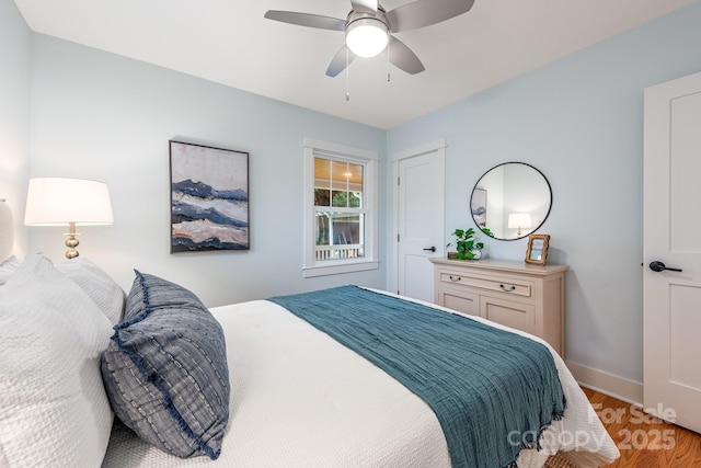 2421 Morton St, Charlotte, NC 28208 - bedroom featuring light wood-type flooring, baseboards, and a ceiling fan