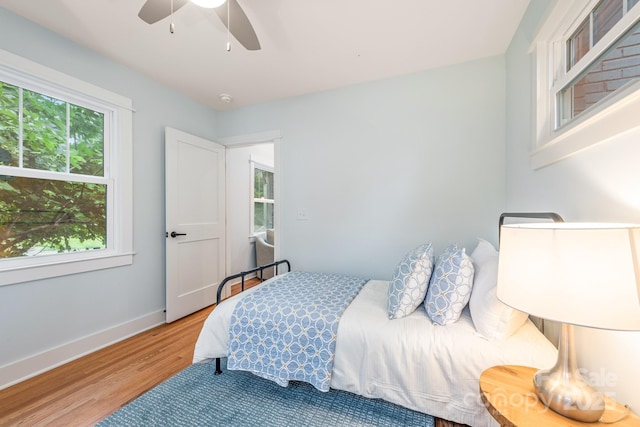 2421 Morton St, Charlotte, NC 28208 - bedroom with wood finished floors, baseboards, and ceiling fan