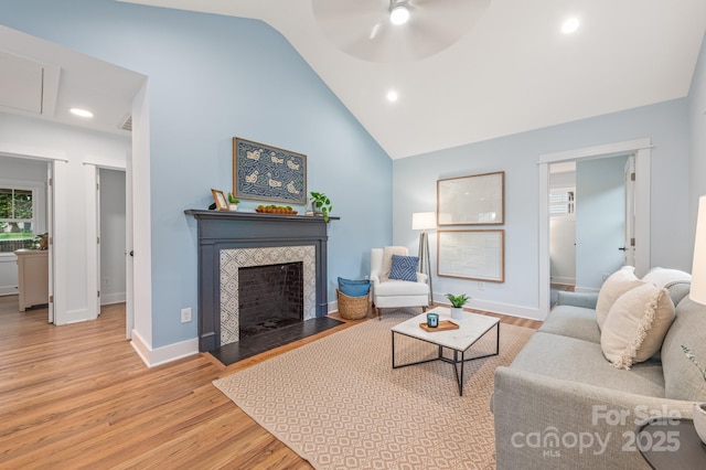 2421 Morton St, Charlotte, NC 28208 - living area featuring wood finished floors, a fireplace, a ceiling fan, baseboards, and recessed lighting