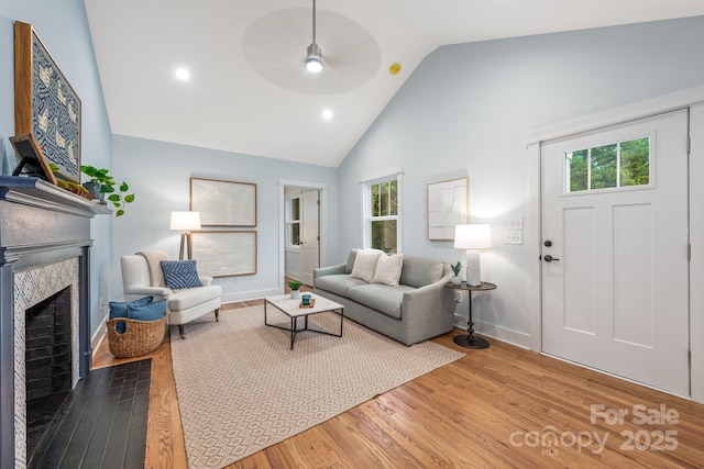 2421 Morton St, Charlotte, NC 28208 - living area featuring a ceiling fan, wood finished floors, healthy amount of natural light, high vaulted ceiling, and recessed lighting