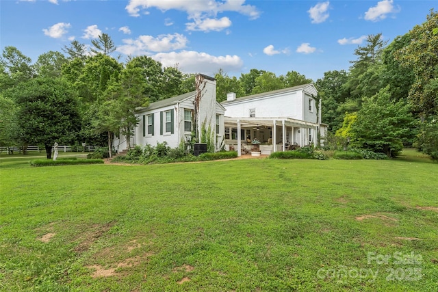 958 US-64, Morganton, NC 28655 - rear view of property with a yard, a patio area, ceiling fan, and a chimney
