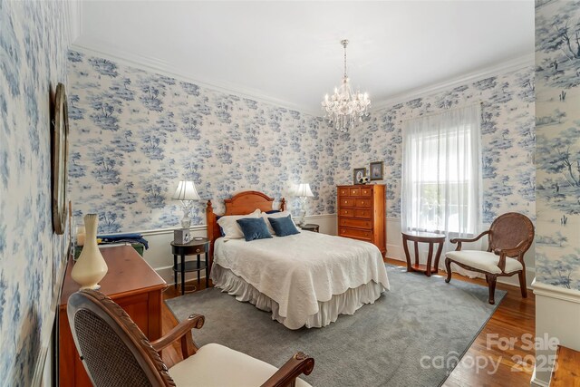 958 US-64, Morganton, NC 28655 - bedroom with crown molding, wood finished floors, and a chandelier