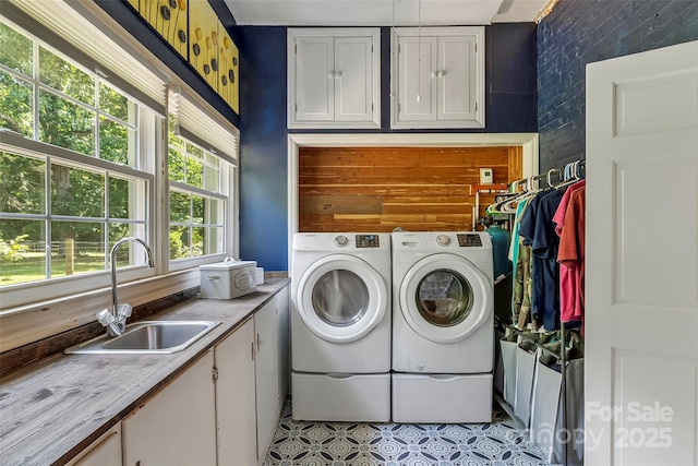 958 US-64, Morganton, NC 28655 - laundry room featuring independent washer and dryer, cabinet space, and light tile patterned flooring
