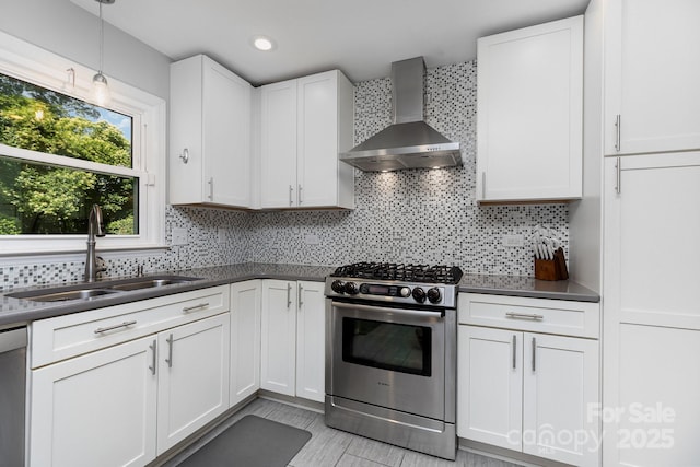 4200 Tyndale Ave, Charlotte, NC 28210 - kitchen featuring stainless steel appliances, wall chimney exhaust hood, dark countertops, white cabinets, and recessed lighting