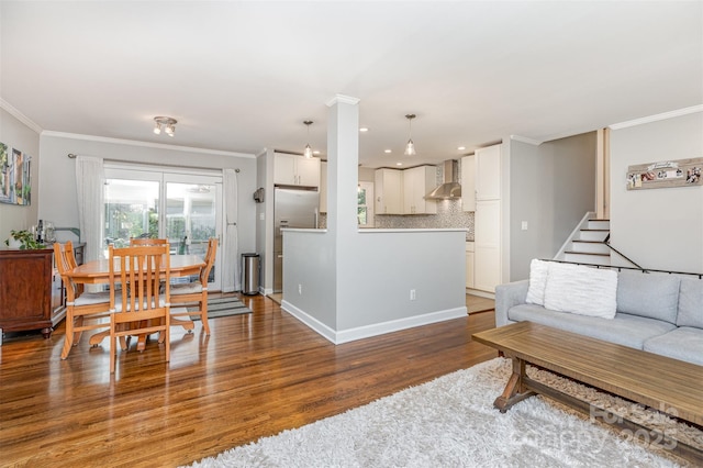 4200 Tyndale Ave, Charlotte, NC 28210 - living area featuring crown molding, wood finished floors, healthy amount of natural light, stairs, and recessed lighting