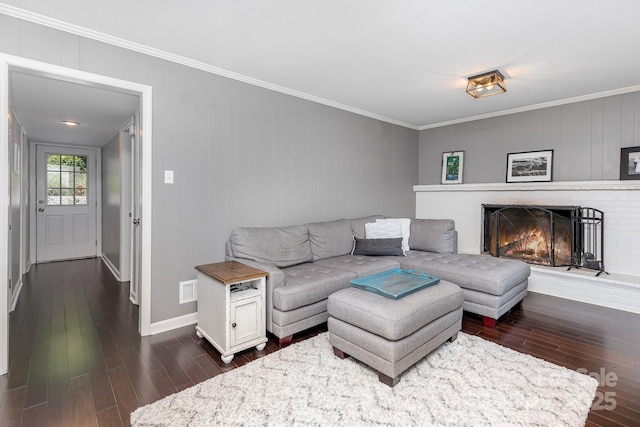 4200 Tyndale Ave, Charlotte, NC 28210 - living room featuring dark wood-type flooring, crown molding, a fireplace, and baseboards