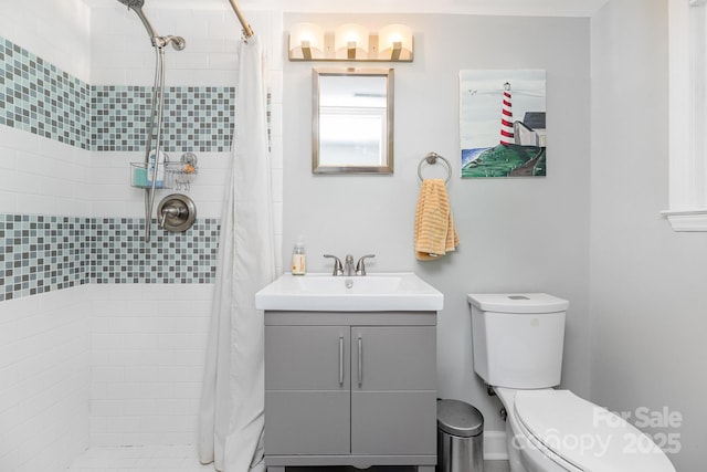 4200 Tyndale Ave, Charlotte, NC 28210 - bathroom featuring vanity, toilet, and tiled shower