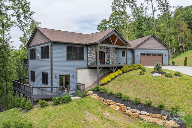 24 Herron View Ln, Weaverville, NC 28787 - view of front of home featuring driveway, an attached garage, a front lawn, stone siding, and a shingled roof