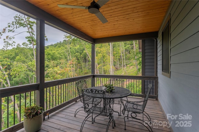 24 Herron View Ln, Weaverville, NC 28787 - wooden deck with a wooded view, a ceiling fan, and outdoor dining area