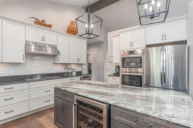 24 Herron View Ln, Weaverville, NC 28787 - kitchen with stainless steel appliances, under cabinet range hood, a chandelier, and wine cooler