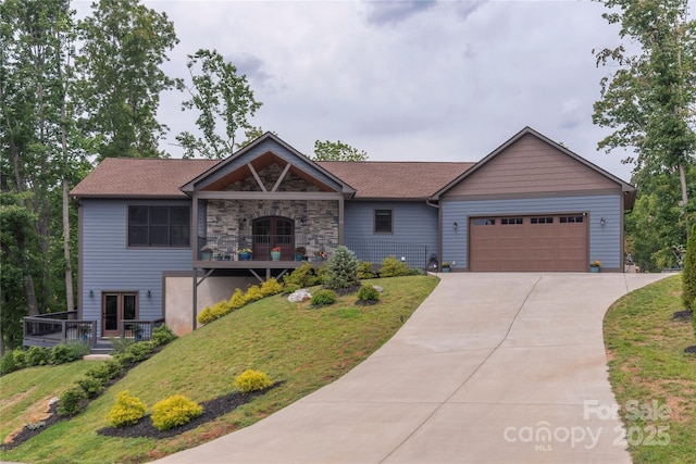 24 Herron View Ln, Weaverville, NC 28787 - view of front of home with a garage, a front lawn, concrete driveway, stone siding, and roof with shingles