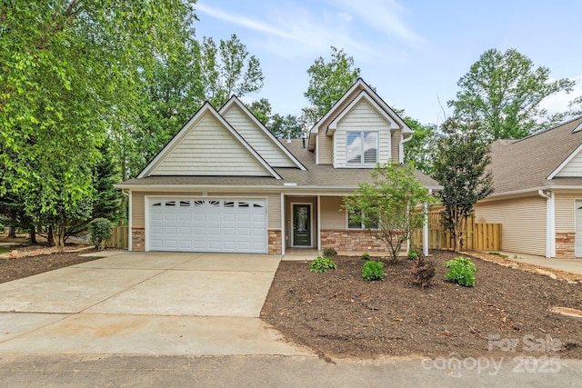 50 Beekeeper Trl, Swannanoa, NC 28778 - traditional-style house with a garage, concrete driveway, and a shingled roof