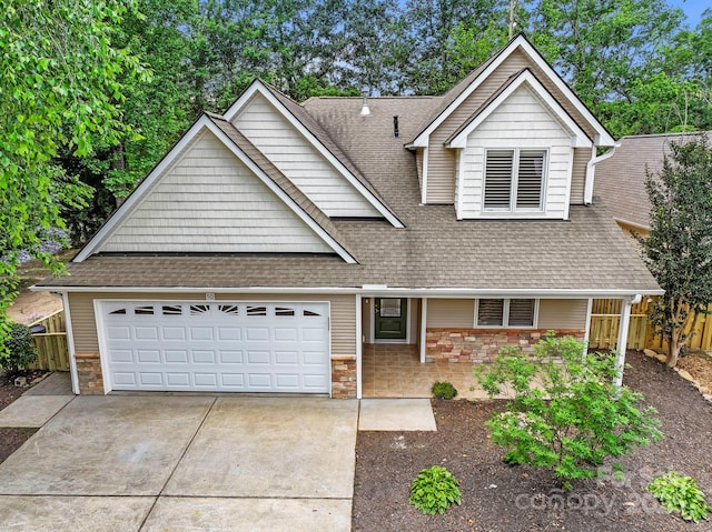 50 Beekeeper Trl, Swannanoa, NC 28778 - view of front of home with stone siding, roof with shingles, and concrete driveway
