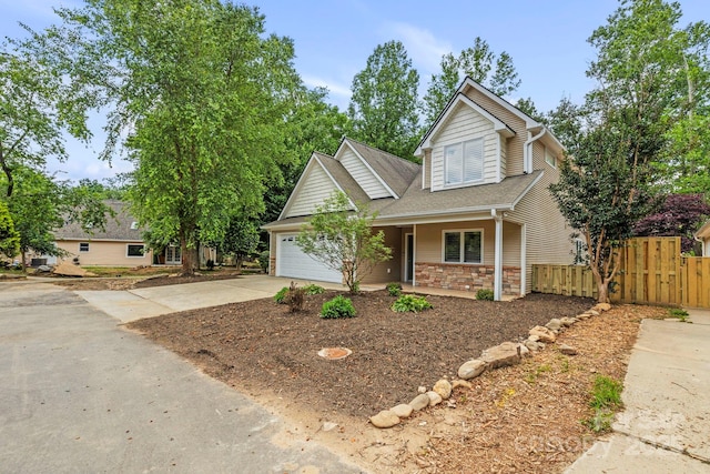 50 Beekeeper Trl, Swannanoa, NC 28778 - traditional-style house with driveway, a garage, covered porch, a shingled roof, and stone siding