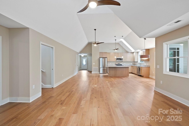 50 Beekeeper Trl, Swannanoa, NC 28778 - unfurnished living room featuring a ceiling fan, light wood-style flooring, lofted ceiling, baseboards, and a sink