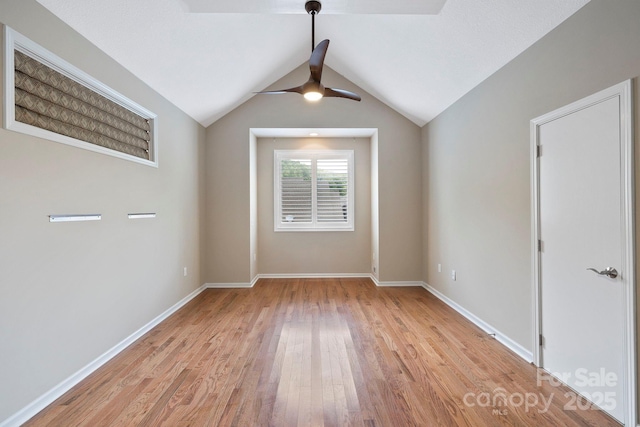50 Beekeeper Trl, Swannanoa, NC 28778 - spare room featuring ceiling fan, light wood-style flooring, baseboards, and lofted ceiling