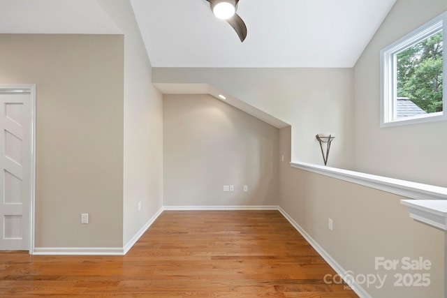 50 Beekeeper Trl, Swannanoa, NC 28778 - additional living space featuring vaulted ceiling, a ceiling fan, light wood-style floors, and baseboards