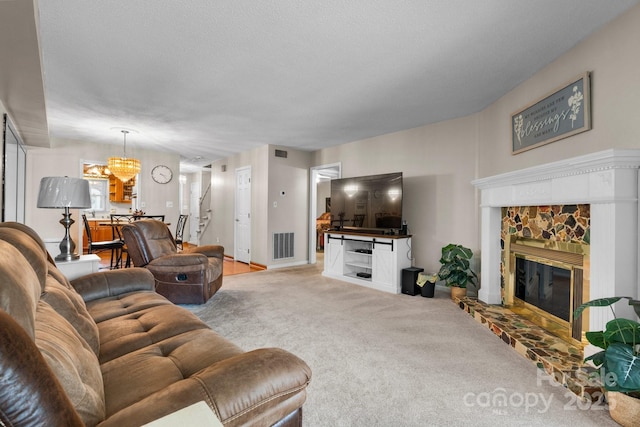 1330 5th St NE Unit 11, Hickory, NC 28601 - living area featuring carpet floors, a chandelier, a stone fireplace, and stairway