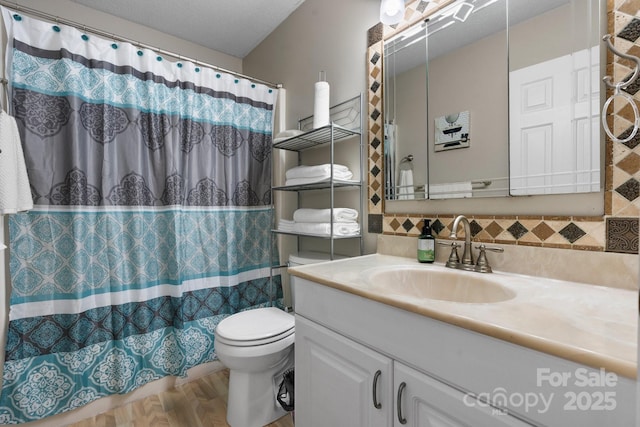 1330 5th St NE Unit 11, Hickory, NC 28601 - full bathroom with vanity, toilet, a shower with curtain, and backsplash