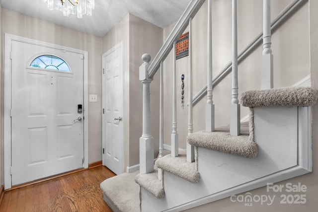 1330 5th St NE Unit 11, Hickory, NC 28601 - entryway featuring stairway, a chandelier, and wood finished floors