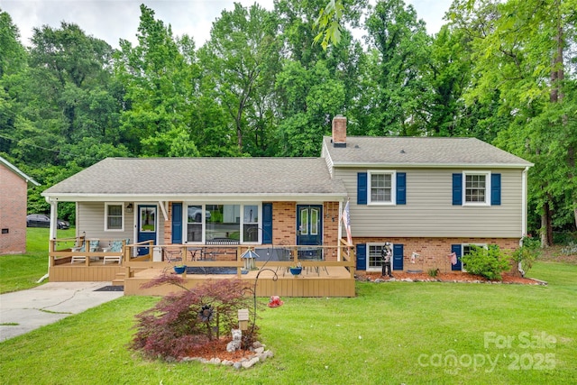 2111 Parkdale Ave, Gastonia, NC 28052 - tri-level home featuring a porch, a chimney, and a front yard