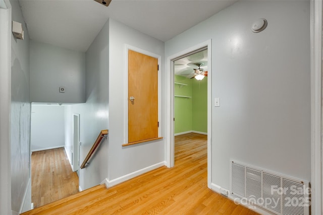 2111 Parkdale Ave, Gastonia, NC 28052 - hallway with an upstairs landing, light wood-style floors, and baseboards
