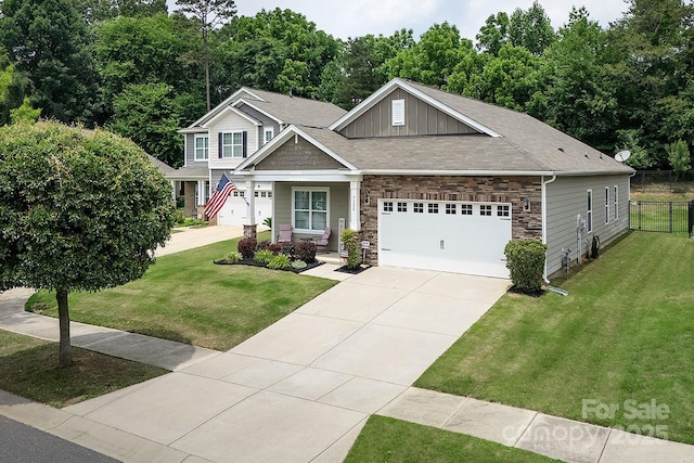 7328 Strawberry Fields Ln, Charlotte, NC 28278 - craftsman house with stone siding, driveway, board and batten siding, a garage, and roof with shingles