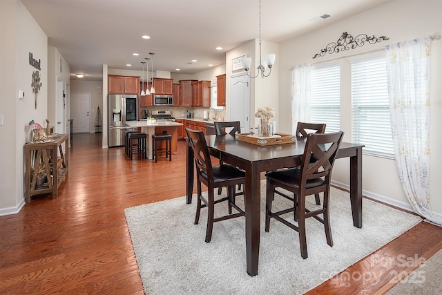 7328 Strawberry Fields Ln, Charlotte, NC 28278 - dining area featuring wood finished floors, baseboards, recessed lighting, and a chandelier