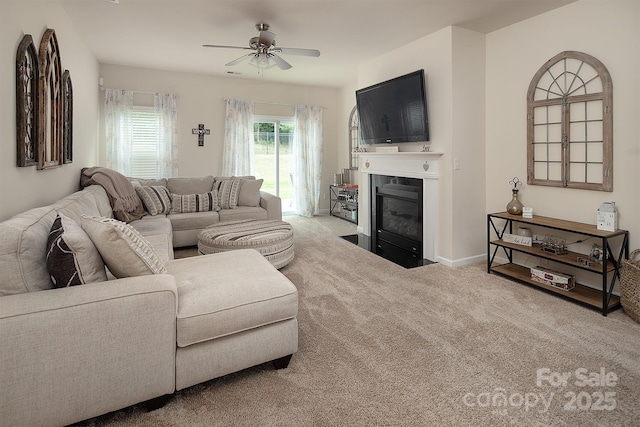 7328 Strawberry Fields Ln, Charlotte, NC 28278 - carpeted living room featuring a ceiling fan, a fireplace with flush hearth, and baseboards