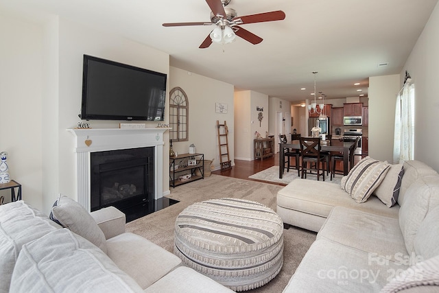 7328 Strawberry Fields Ln, Charlotte, NC 28278 - living area featuring ceiling fan, carpet, a fireplace with flush hearth, and recessed lighting