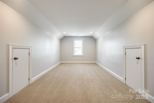 509 Abelia Ln, Tega Cay, SC 29708 - additional living space featuring vaulted ceiling, light colored carpet, baseboards, and recessed lighting