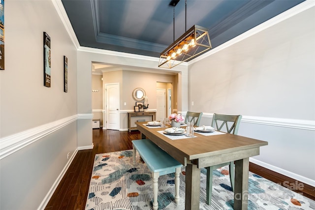 129 Hawks Creek Pkwy, Fort Mill, SC 29708 - dining area with ornamental molding, dark wood finished floors, a chandelier, and a tray ceiling