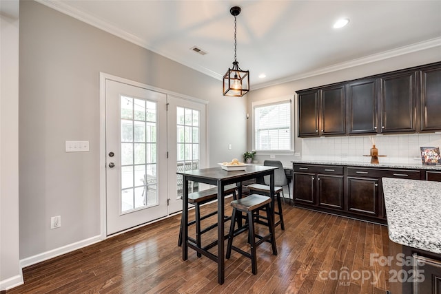 129 Hawks Creek Pkwy, Fort Mill, SC 29708 - dining space featuring dark wood finished floors, crown molding, and recessed lighting