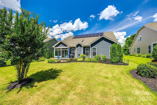 129 Hawks Creek Pkwy, Fort Mill, SC 29708 - view of front facade featuring solar panels, a front yard, a shingled roof, and a patio
