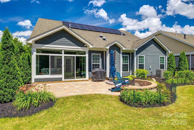 129 Hawks Creek Pkwy, Fort Mill, SC 29708 - rear view of property with a patio, a sunroom, a shingled roof, and solar panels