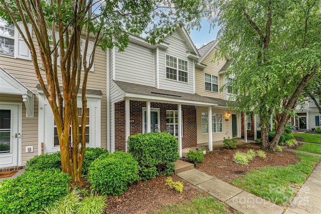 10223 Reindeer Way Ln, Charlotte, NC 28216 - view of front facade with brick siding and roof with shingles