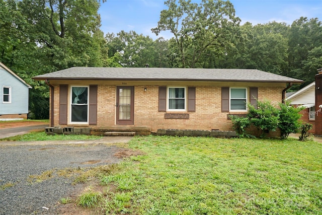 924 Carrington Dr, Charlotte, NC 28214 - ranch-style home with brick siding, a front yard, crawl space, and roof with shingles