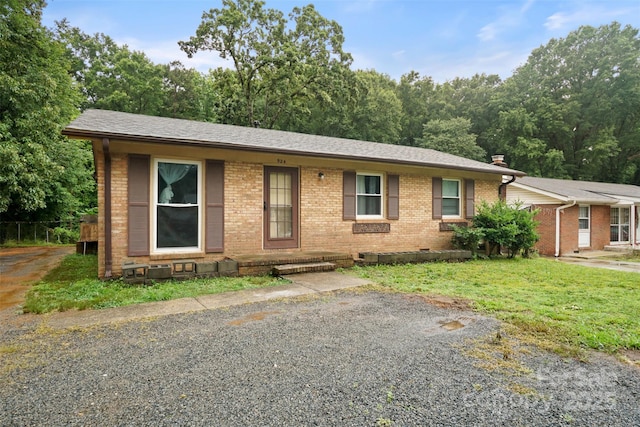924 Carrington Dr, Charlotte, NC 28214 - ranch-style home with brick siding, a shingled roof, and crawl space